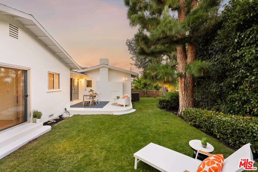 10749 Molony Road Culver City, CA 90230 - Photo 18 of 19 a view of a backyard with couches plants and large trees