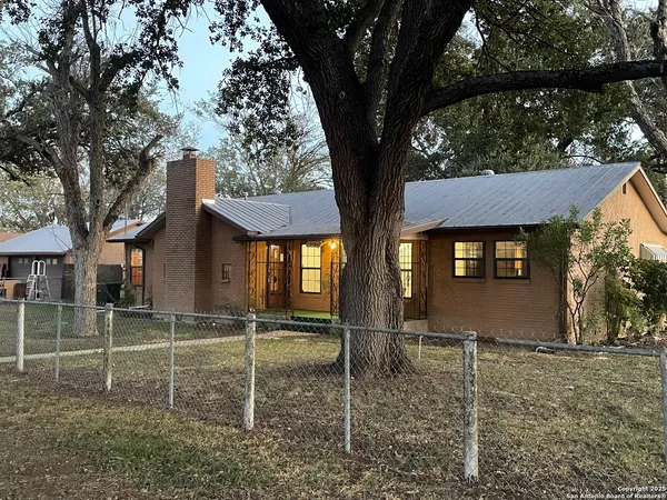 a house with trees in front of it