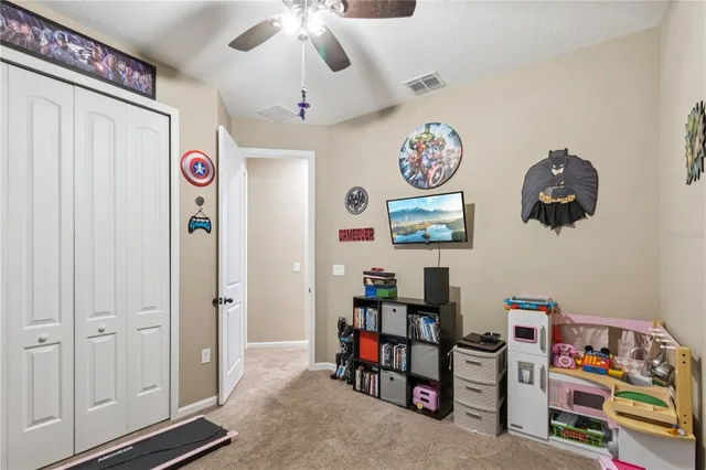 a bedroom with furniture and a baby crib