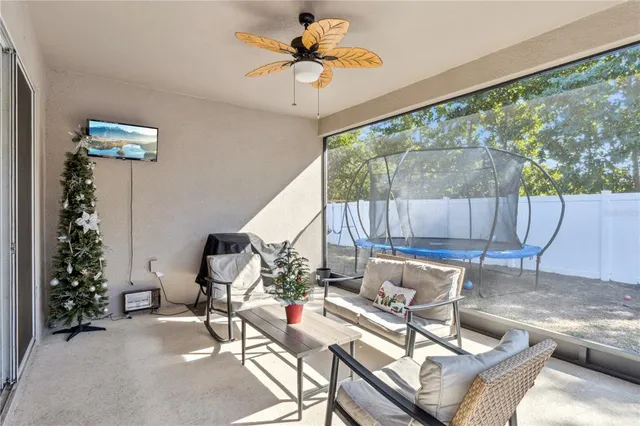 a view of a backyard with a wooden fence