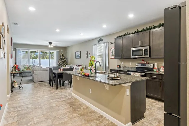 a bedroom with furniture and a large window