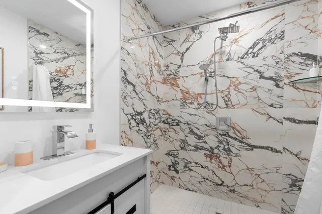 a bathroom with a sink and a shower curtain