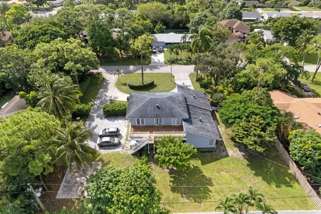 an aerial view of house with yard swimming pool and outdoor seating