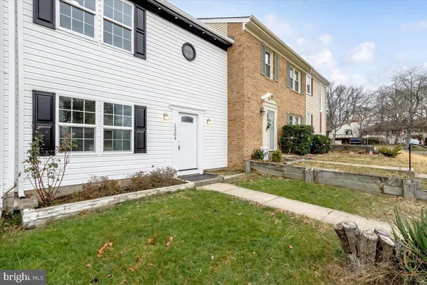 a house view with a garden space