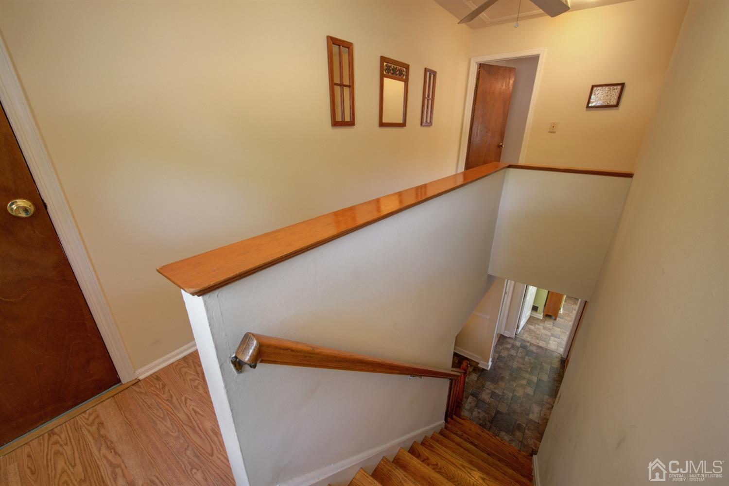 43 Brookside Road Spotswood, NJ 08884 - Photo 14 of 27 a view of stairs and with wooden floor