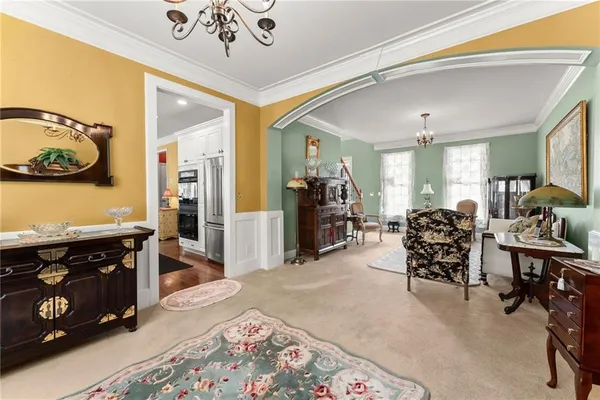 a bed room with a bed and a chandelier