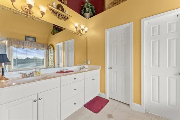 a white toilet sitting next to a bathroom sink