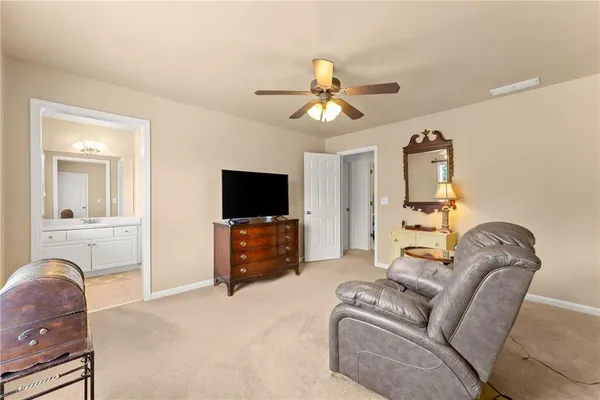 a view of a livingroom with a chair and a window
