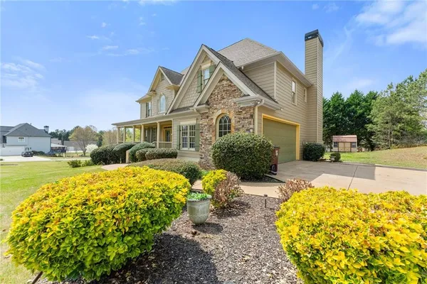 a front view of a house with a swimming pool