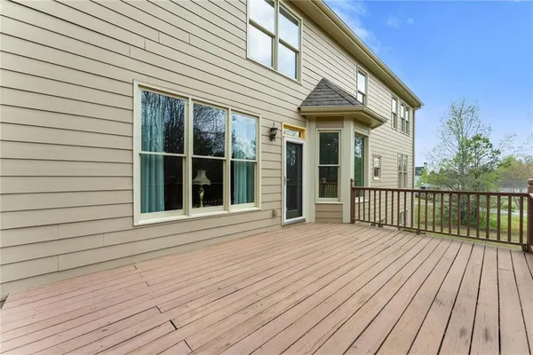 an aerial view of a house with a yard basket ball court and outdoor seating