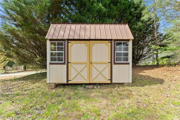 an aerial view of a residential houses with outdoor space