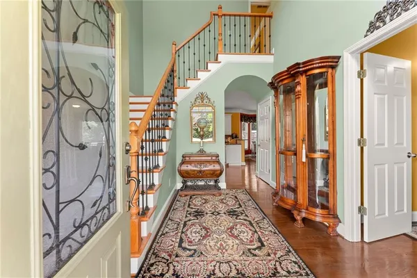 a view of an entryway with wooden floor