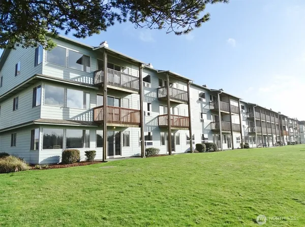 a view of a building with a yard
