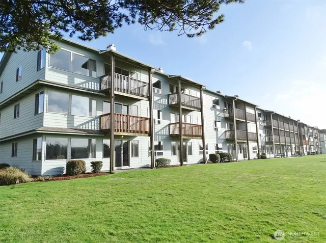 a view of a building with a yard