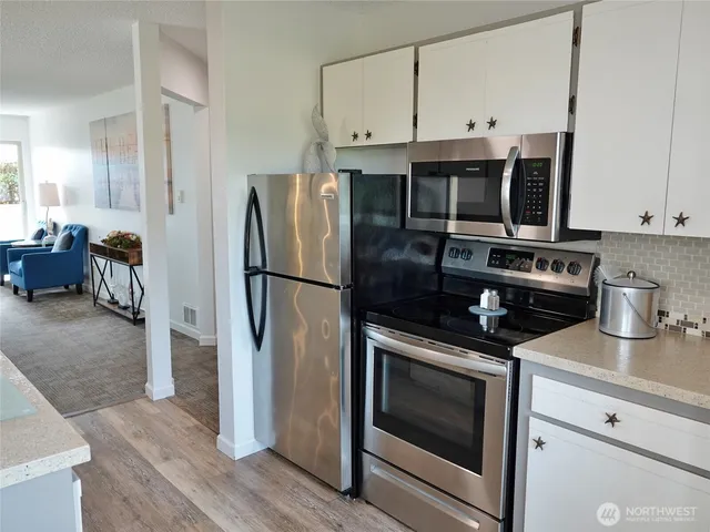 a kitchen with a sink and cabinets