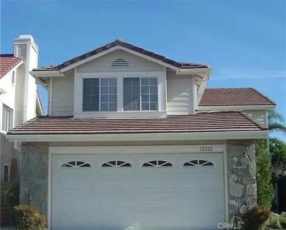 12222 Crystal Ridge Way Porter Ranch, CA 91326 - Photo 1 of 1 a front view of a house with a windows