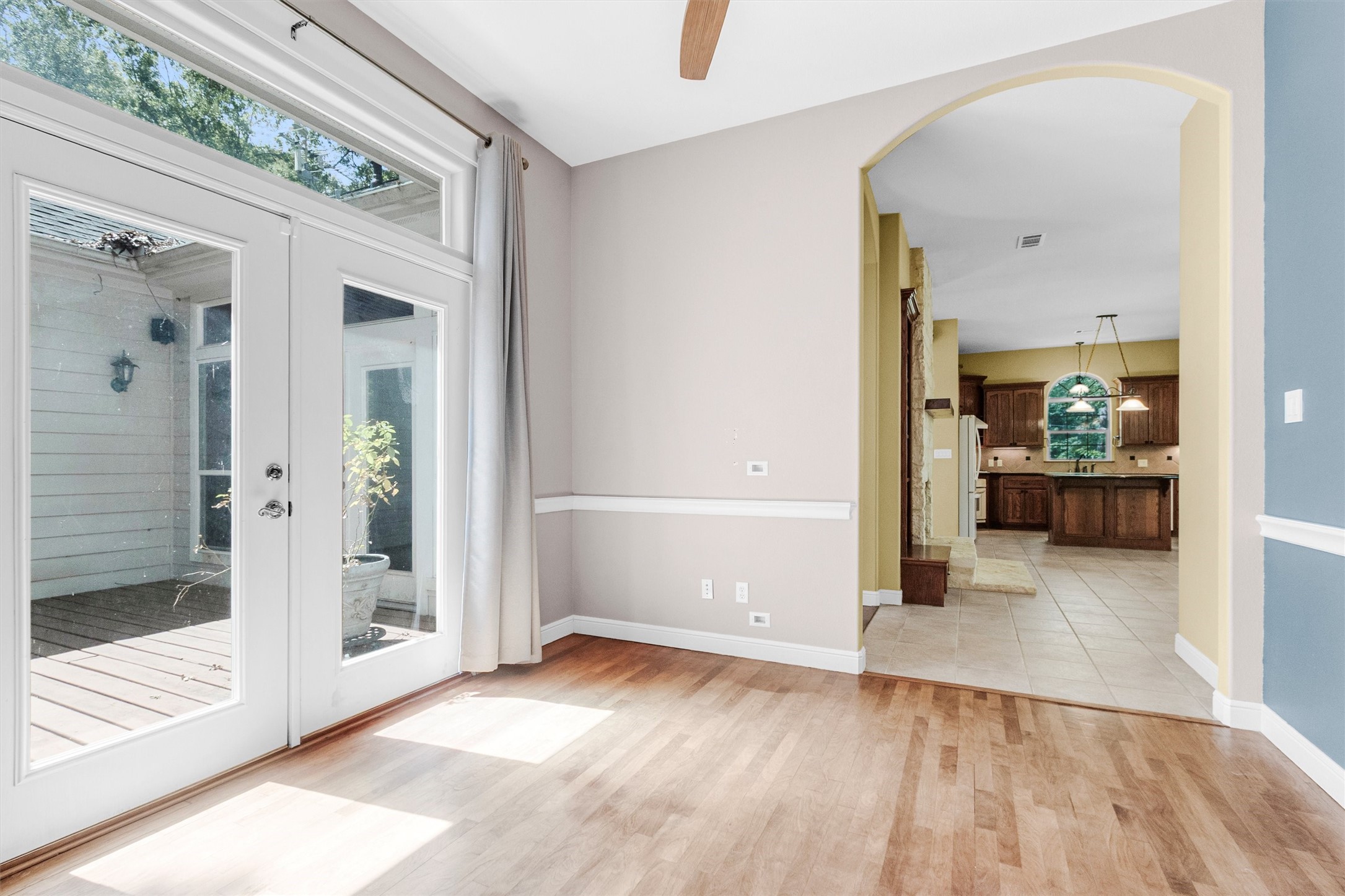 10331 Iron Ore Road Conroe, TX 77303 - Photo 13 of 47 Bright and inviting space featuring elegant French doors opening to a rear deck.