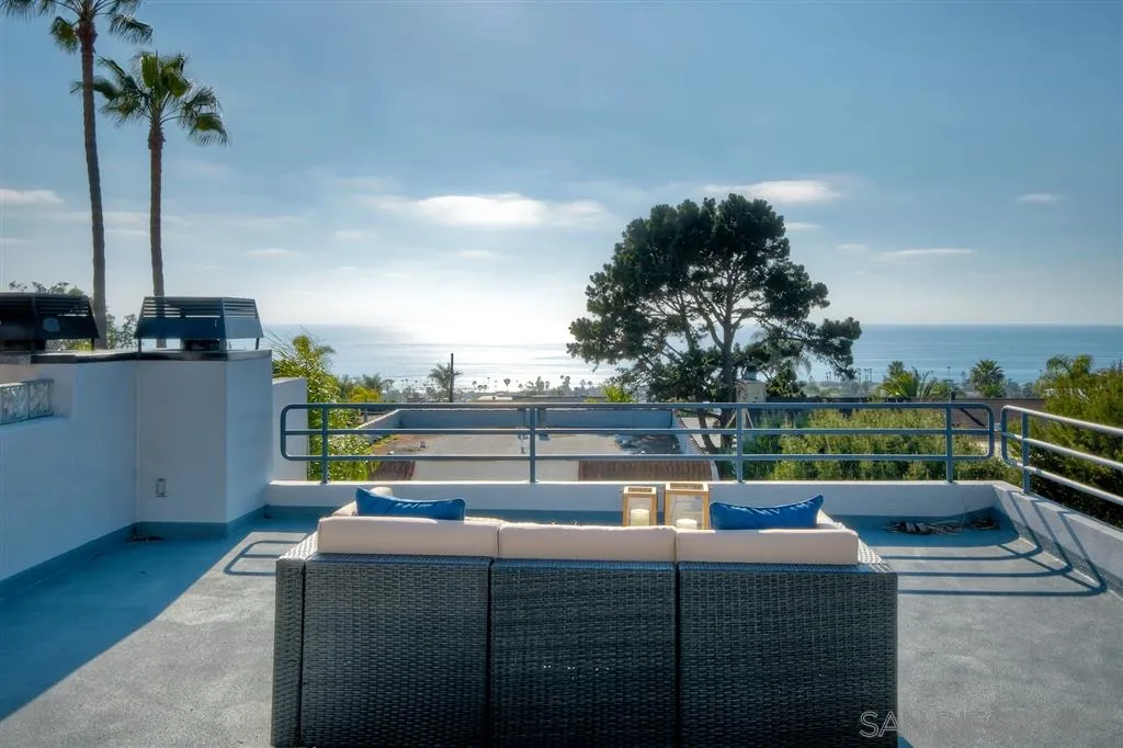 2136 Glasgow Avenue Cardiff, CA 92007 - Photo 1 of 25 a living room with a couch and a potted plant