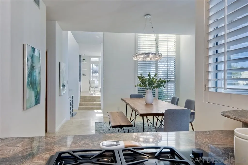 2136 Glasgow Avenue Cardiff, CA 92007 - Photo 12 of 25 a view of a dining room with furniture window and wooden floor
