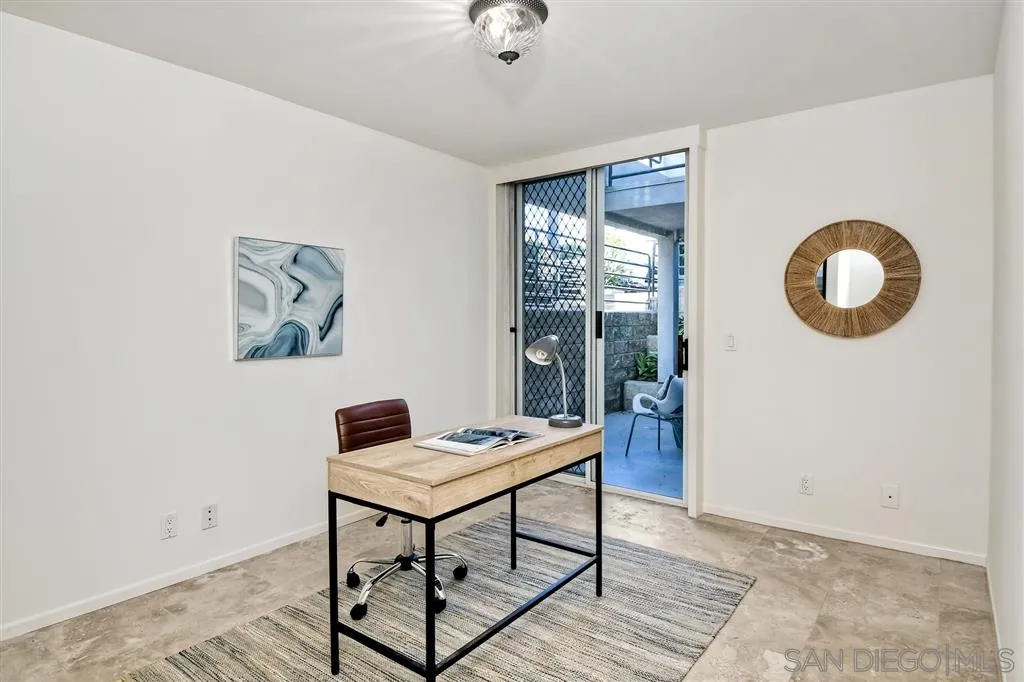 2136 Glasgow Avenue Cardiff, CA 92007 - Photo 13 of 25 a view of a workspace with furniture and a window
