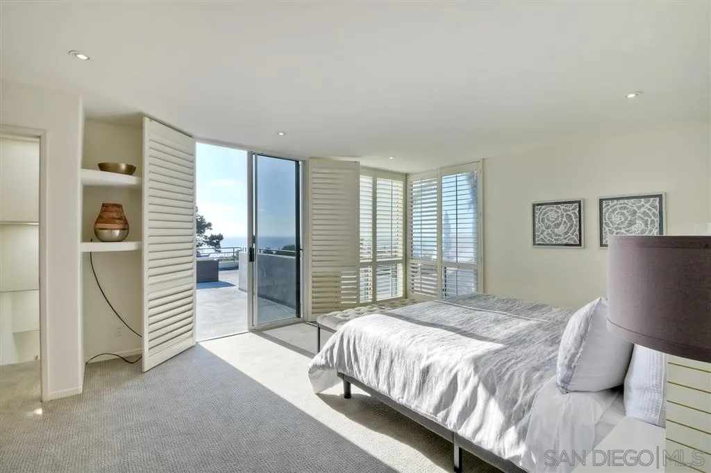 2136 Glasgow Avenue Cardiff, CA 92007 - Photo 15 of 25 a bedroom with a bed and a large window