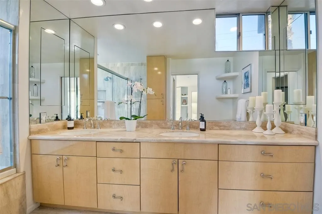 2136 Glasgow Avenue Cardiff, CA 92007 - Photo 17 of 25 a bathroom with a sink and a mirror