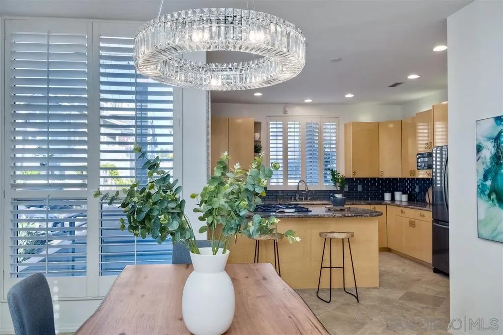2136 Glasgow Avenue Cardiff, CA 92007 - Photo 9 of 25 a kitchen with a table and chairs in it