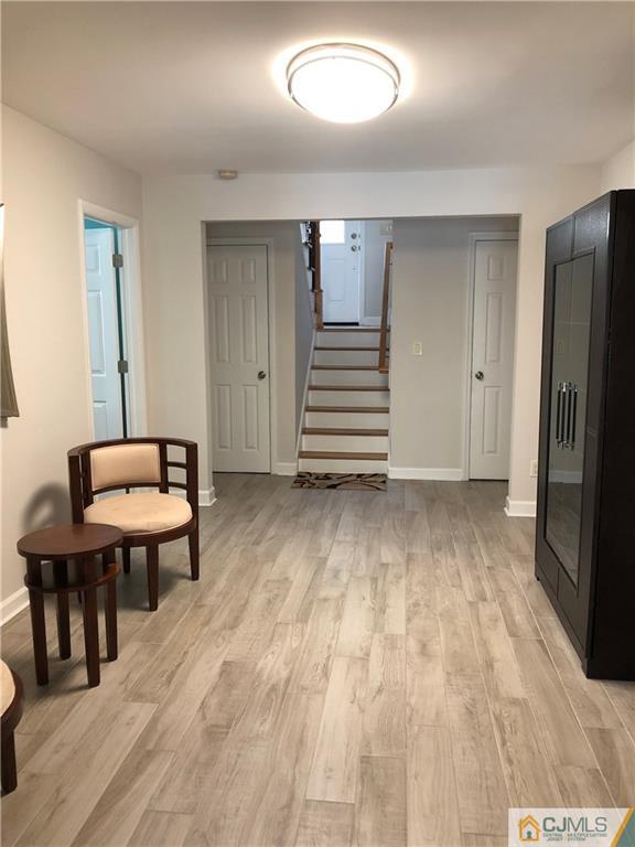 144 Kimberly Road Colonia, NJ 07067 - Photo 14 of 27 a view of a livingroom with furniture and staircase
