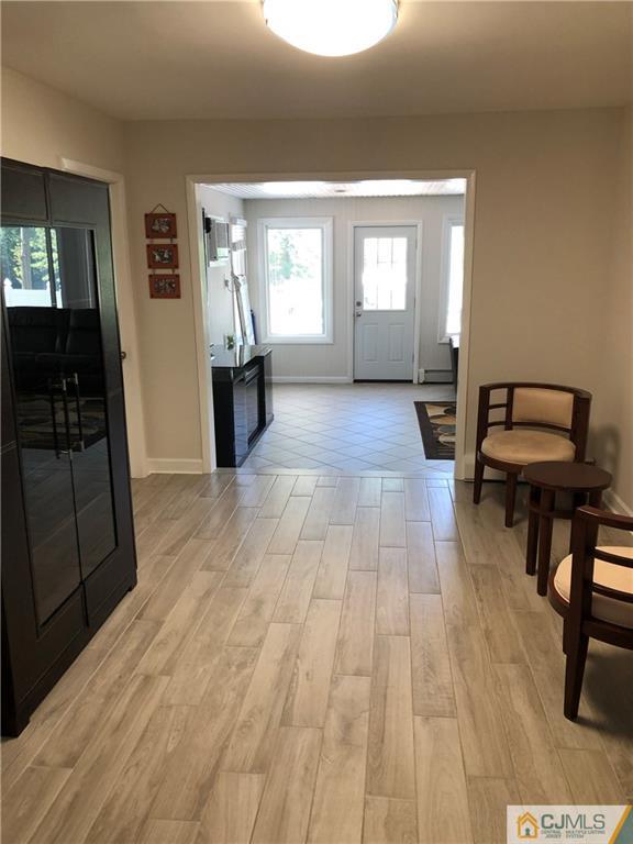 144 Kimberly Road Colonia, NJ 07067 - Photo 16 of 27 a view of a room with wooden floor and furniture