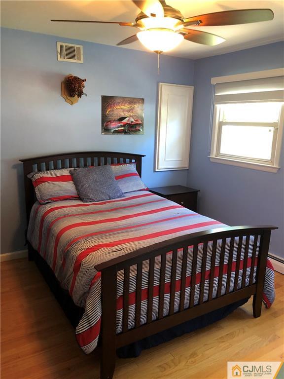 144 Kimberly Road Colonia, NJ 07067 - Photo 17 of 27 a bedroom with a bed and window