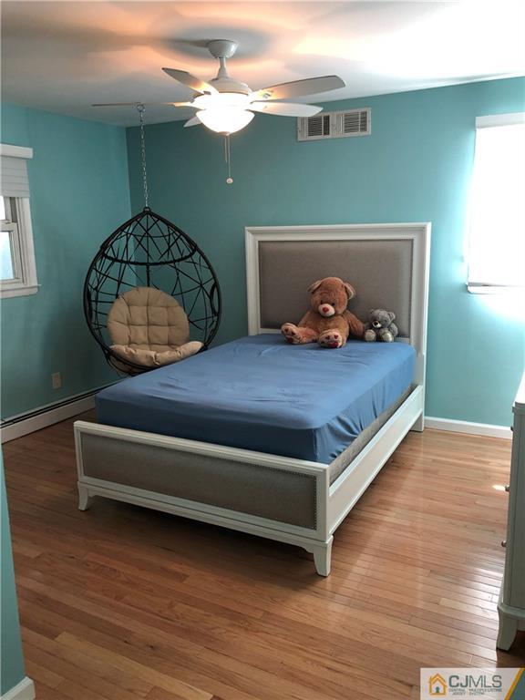 144 Kimberly Road Colonia, NJ 07067 - Photo 18 of 27 a bedroom with a bed and window