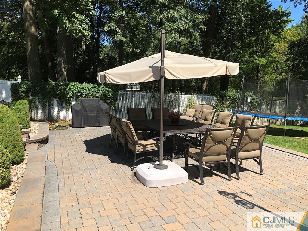 144 Kimberly Road Colonia, NJ 07067 - Photo 23 of 27 a view of a patio with a table chairs and a patio