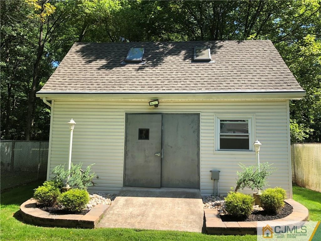 144 Kimberly Road Colonia, NJ 07067 - Photo 26 of 27 a view of a house with backyard and garden