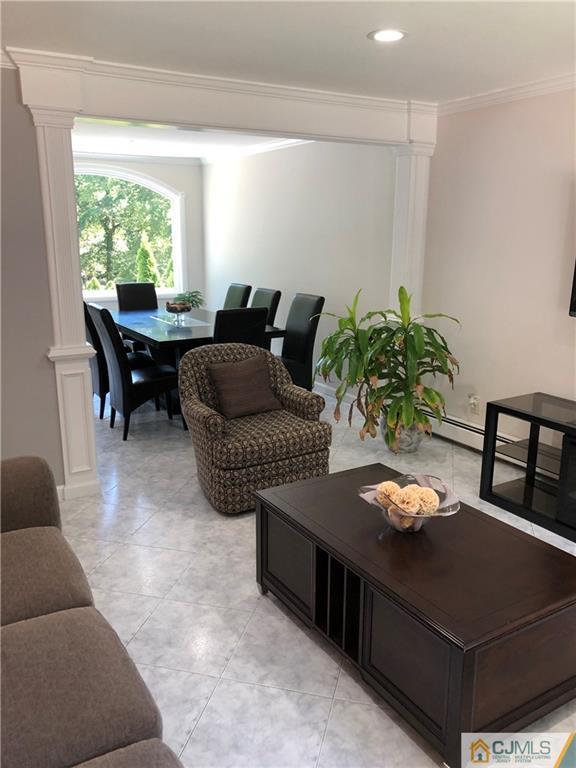 144 Kimberly Road Colonia, NJ 07067 - Photo 4 of 27 a living room with furniture and a potted plant