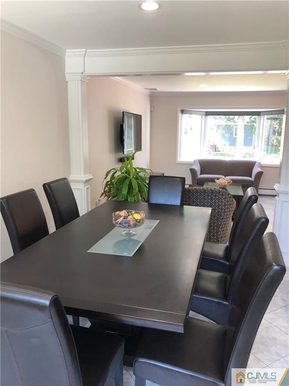 144 Kimberly Road Colonia, NJ 07067 - Photo 5 of 27 a living room with furniture and a table