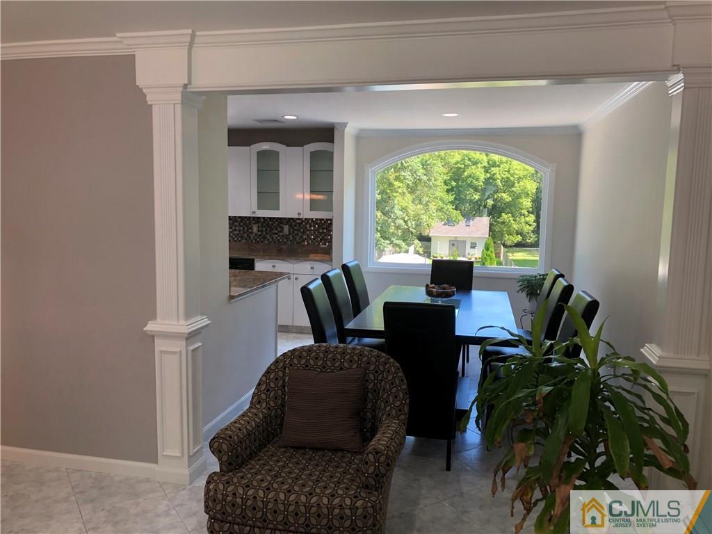 144 Kimberly Road Colonia, NJ 07067 - Photo 9 of 27 a living room with furniture and a potted plant