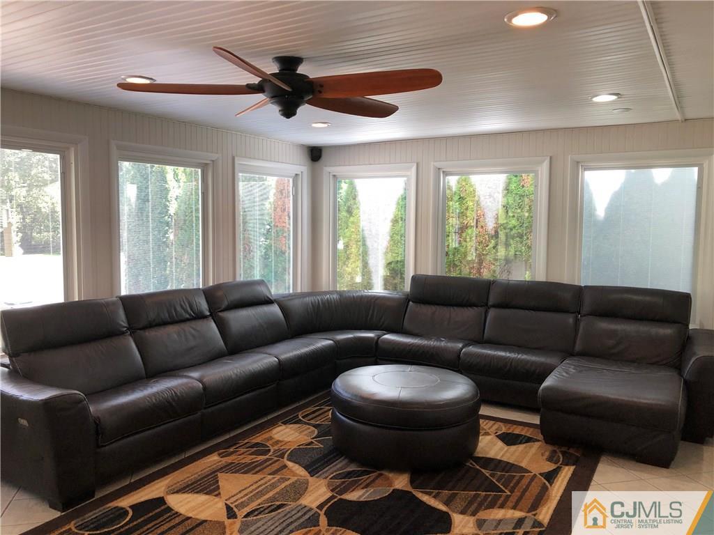 144 Kimberly Road Colonia, NJ 07067 - Photo 10 of 27 a living room with furniture and a large window