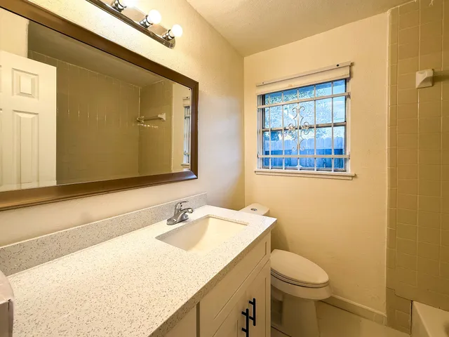 a bathroom with a sink and mirror