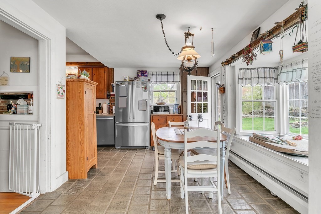 175 Brimfield Road Monson, MA 01057 - Photo 18 of 41 a dining room with furniture a chandelier and window