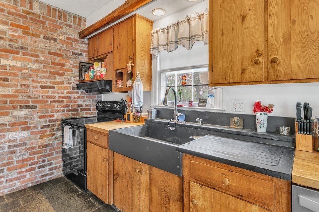 175 Brimfield Road Monson, MA 01057 - Photo 19 of 41 a kitchen with stainless steel appliances a sink stove and cabinets