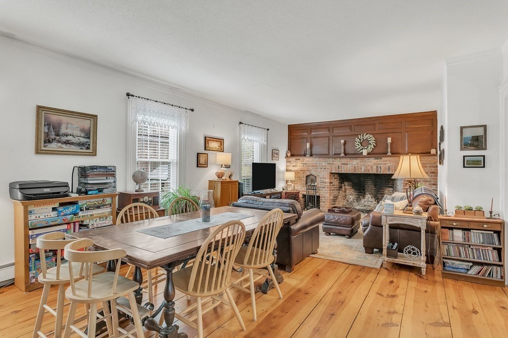 175 Brimfield Road Monson, MA 01057 - Photo 27 of 41 a view of a dining room with furniture a rug and wooden floor