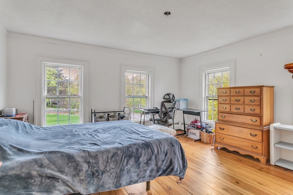 175 Brimfield Road Monson, MA 01057 - Photo 34 of 41 a bedroom with a bed a dresser and with windows