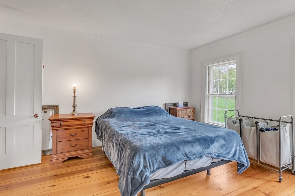 175 Brimfield Road Monson, MA 01057 - Photo 36 of 41 a bed sitting in a bedroom next to a window