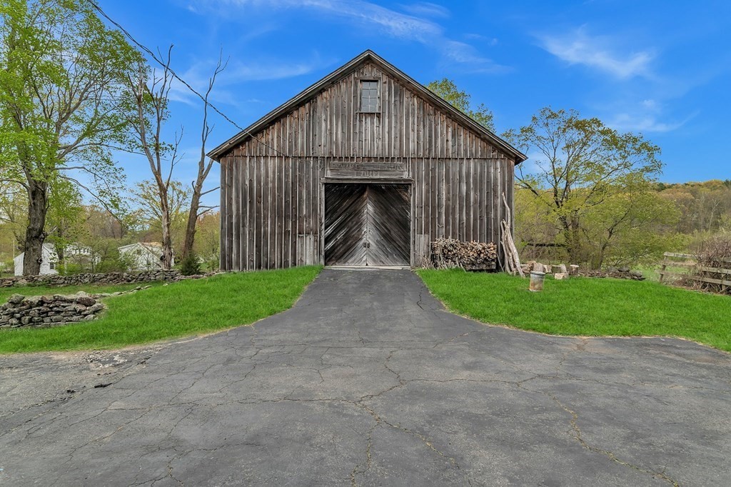 175 Brimfield Road Monson, MA 01057 - Photo 7 of 41 a view of a big house with a big yard and large trees