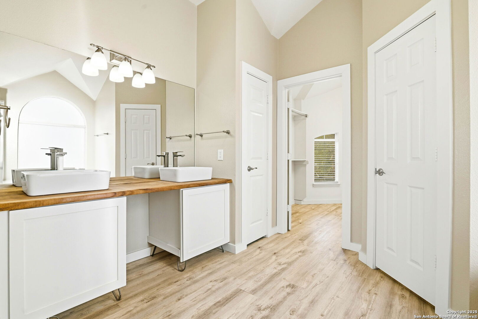 21211 Rio Sabinal San Antonio, TX 78259 - Photo 15 of 31 a bathroom with a sink and a mirror