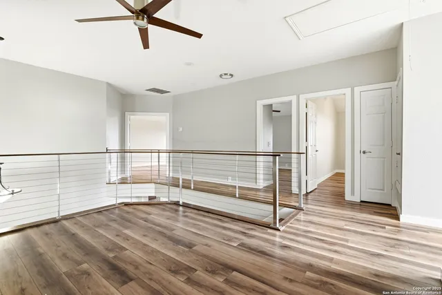 a view of entryway and hall with wooden floor