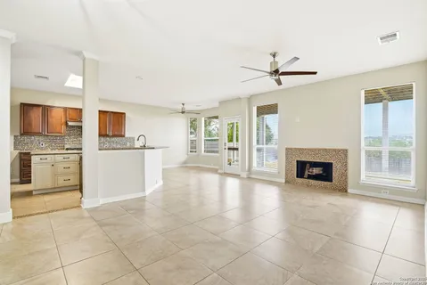 a view of a kitchen with furniture and a fireplace