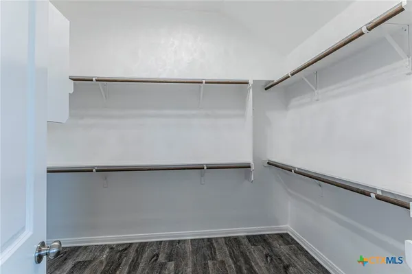 a view of an empty walk in closet