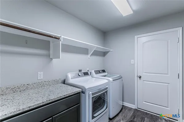 a utility room with dryer and washer