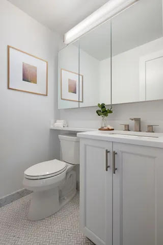 a spacious bedroom with a bed and a window